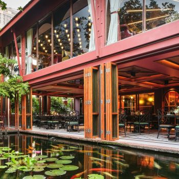 Exterior view of Jim Thompson restaurant beside the pond
